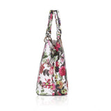 White pink faux leather printed handheld bag with dual handle, synthetic lining, and zipper closure