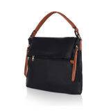 Black faux leather sling bag with zipper closure and dual handle strap