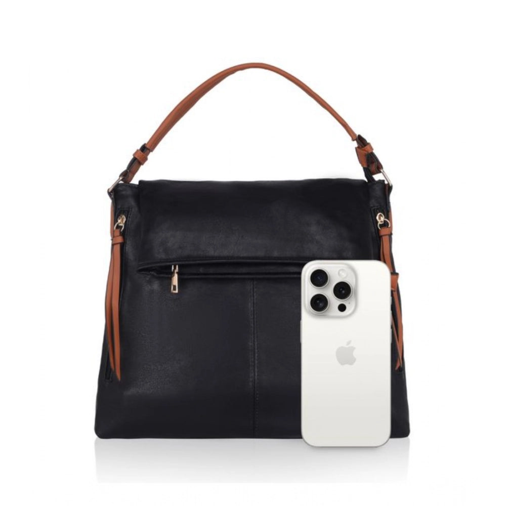 Black faux leather sling bag with dual handles and zipper closure