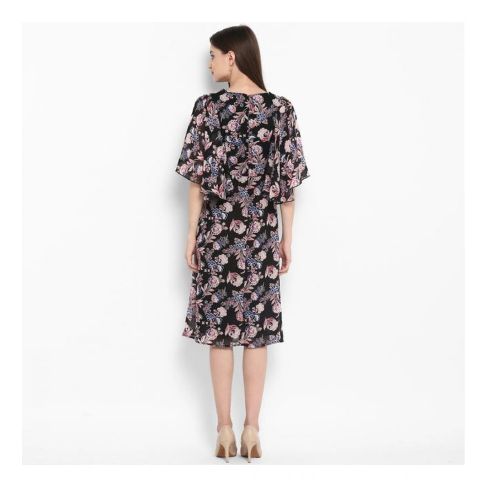 Black & multicolor polyester floral short sleeve knee-length dress on model, vibrant floral pattern
