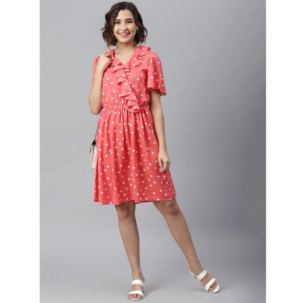 Coral polyester polka flutter dress for women, vibrant style on mannequin