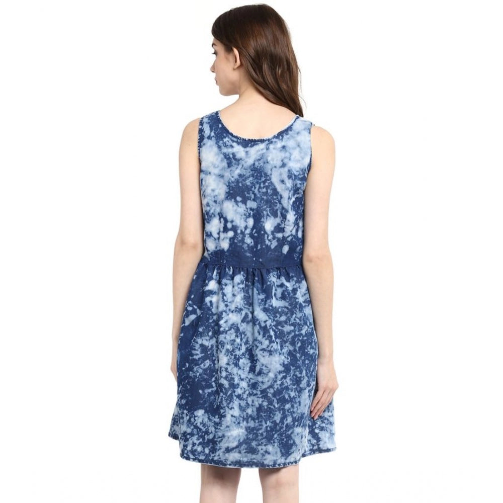 Blue denim tie & dye sleeveless above-knee dress on model, vibrant pattern visible