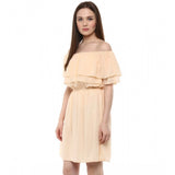 Beige polyester sleeveless knee-length dress - solid design, off shoulder neckline on model