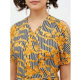Yellow polyester printed half-sleeve long jumpsuit on model, vibrant pattern design
