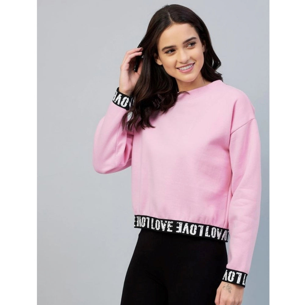 Pink fleece women's long-sleeve solid sweatshirt on model, round neck style