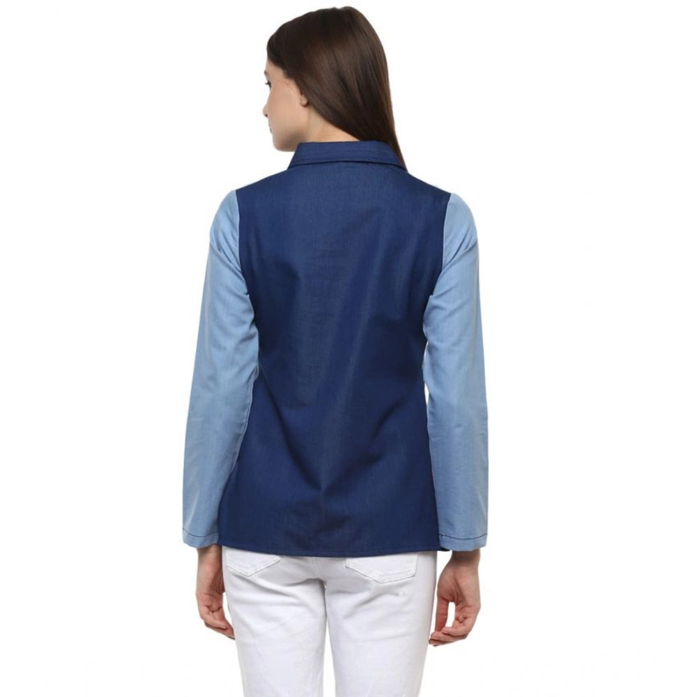 Blue denim patchwork long-sleeve top on hanger