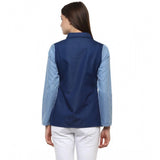 Blue denim patchwork long-sleeve top on hanger