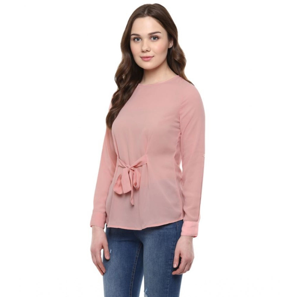Pink polyester women's long sleeve solid top, round neck, regular length on mannequin