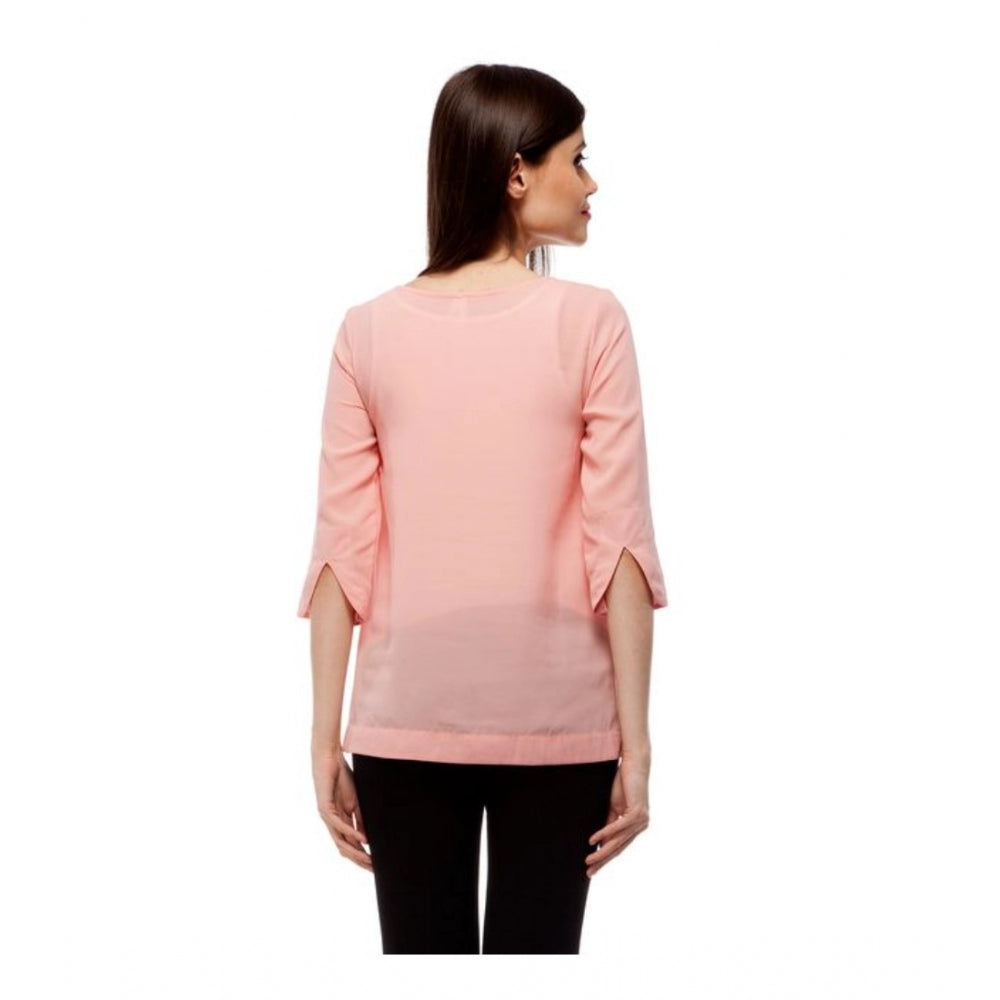Peach polyester solid 3/4th sleeves regular top for women, round neck style on clothing rack