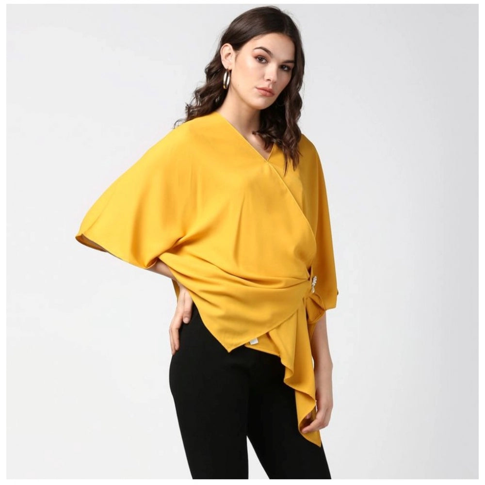 Yellow polyester solid cape sleeve top for women, vibrant and stylish fashion wear on a hanger