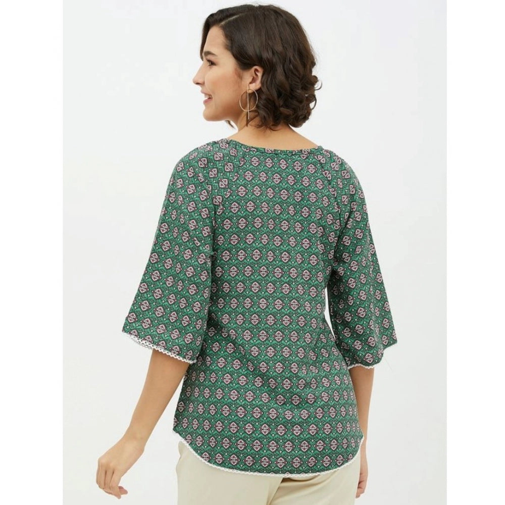 Green polyester printed 3/4th sleeves top with round neck, vibrant print detail