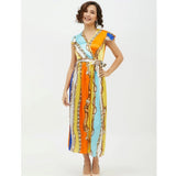 Multicolor satin chain print cap sleeve calf-length dress on fashion model, vibrant pattern detail visible