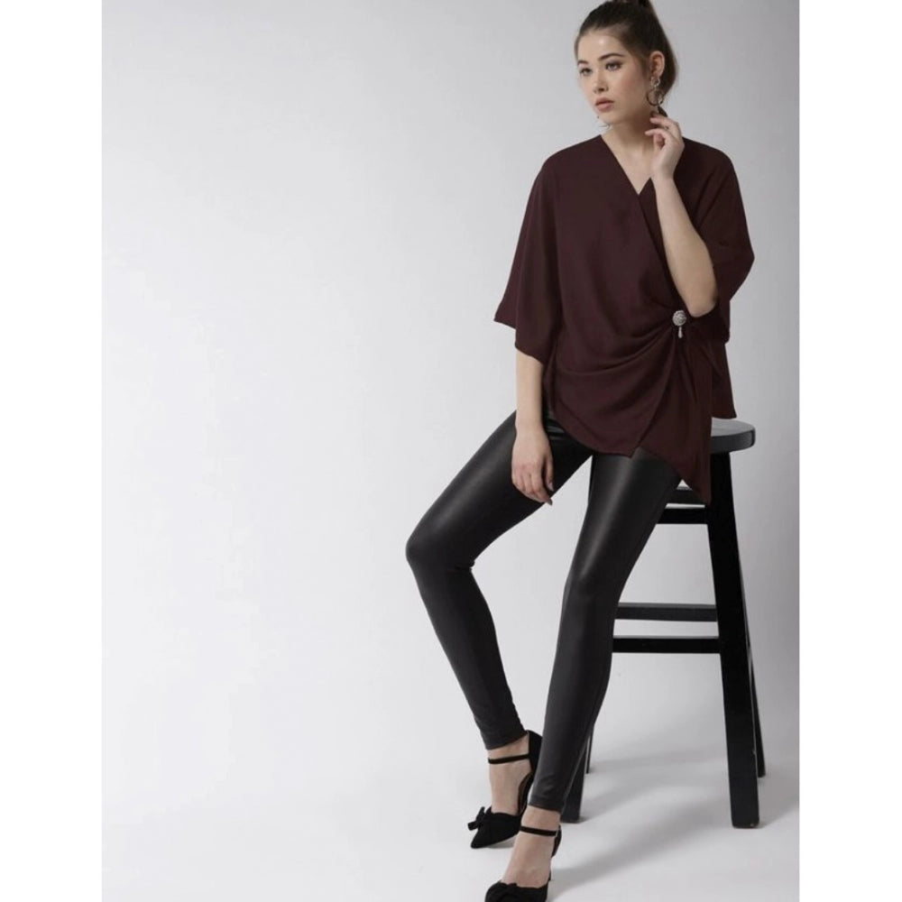 Maroon polyester solid cape sleeve top for women's fashion, close-up view