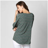 Green polyester printed 3/4 sleeves top for women, casual fashion wear on mannequin