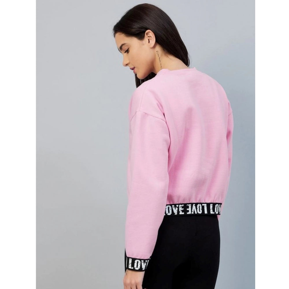 Pink fleece women's long-sleeve sweatshirt, solid design on display