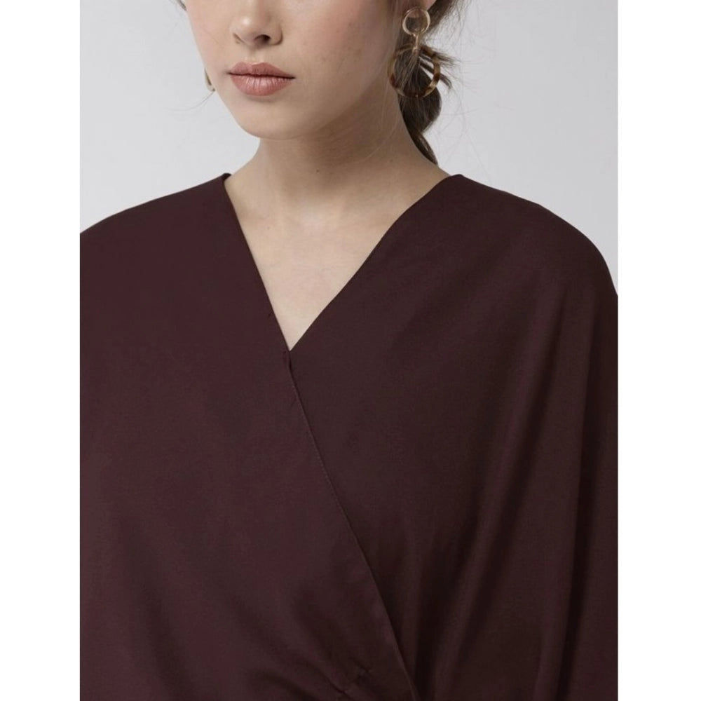 Maroon polyester solid cape sleeve top for women's fashion, vibrant v-neck design on display
