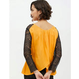 Yellow rayon lace inserts long sleeves top for women, intricate lace detailing on a yellow background