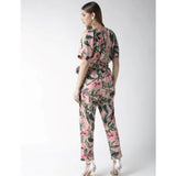Pink polyester floral half-sleeve jumpsuit on model, vibrant floral pattern