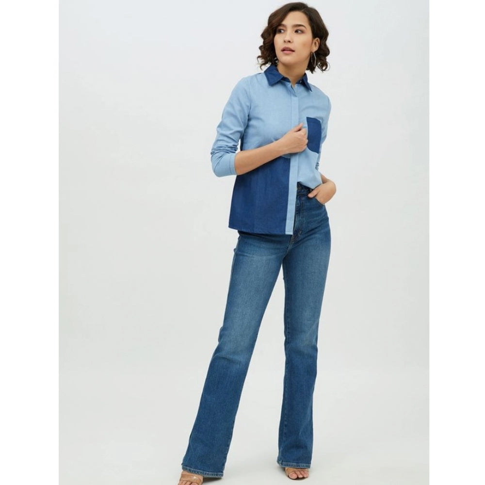 Blue denim patchwork long-sleeve shirt on mannequin