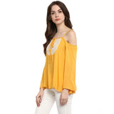 Mustard yellow rayon embellished cold shoulder regular top on model