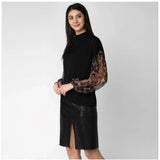 Black polyester animal print long sleeves top with closed neck, vibrant pattern detail