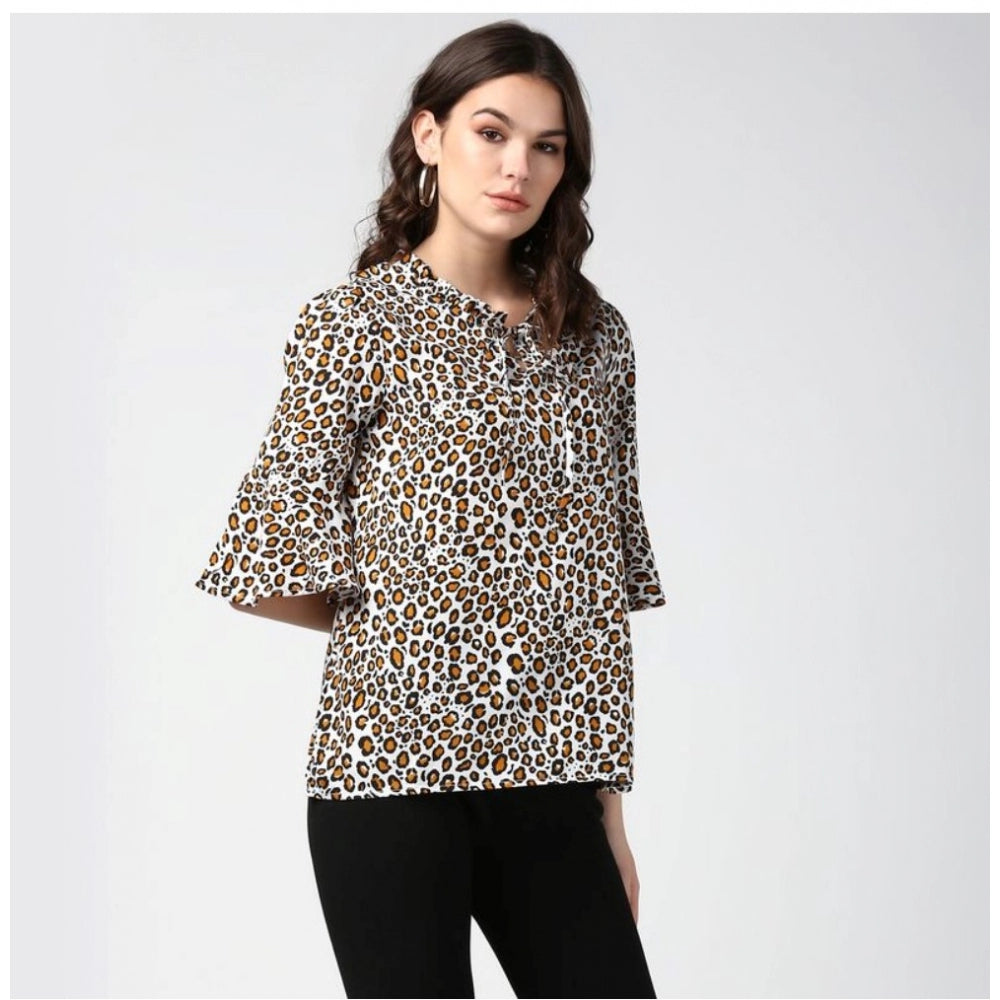 Orange & black polyester animal print bell sleeve top for women's fashion, collar neckline, patterned accessory on mannequin