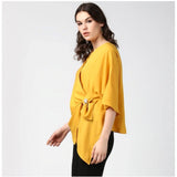 Yellow polyester solid cape sleeve top for women's fashion, vibrant yellow color on display