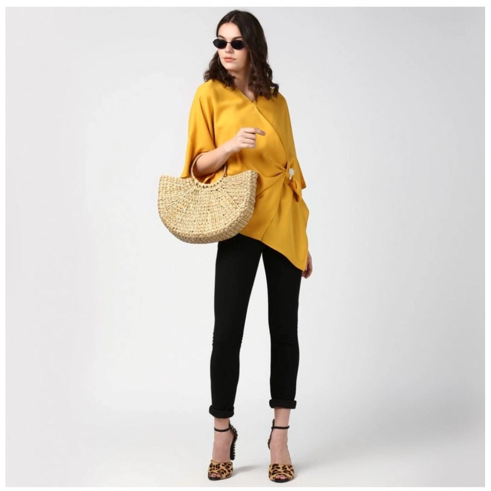 Yellow polyester solid cape sleeve top for women's casual wear, vibrant yellow color on model