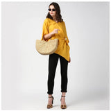 Yellow polyester solid cape sleeve top for women's casual wear, vibrant yellow color on model