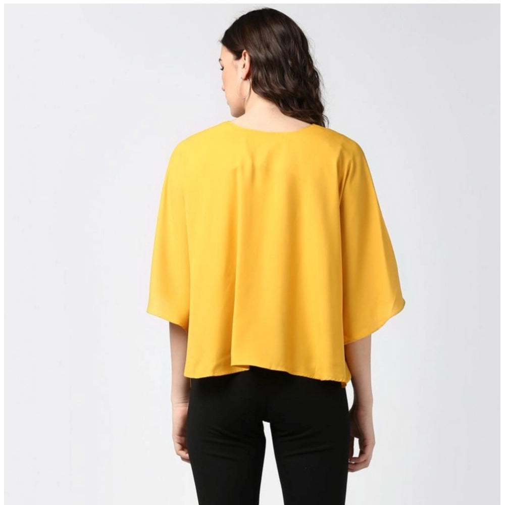 Yellow polyester solid cape sleeve top for women on hanger, vibrant yellow color, versatile wardrobe staple
