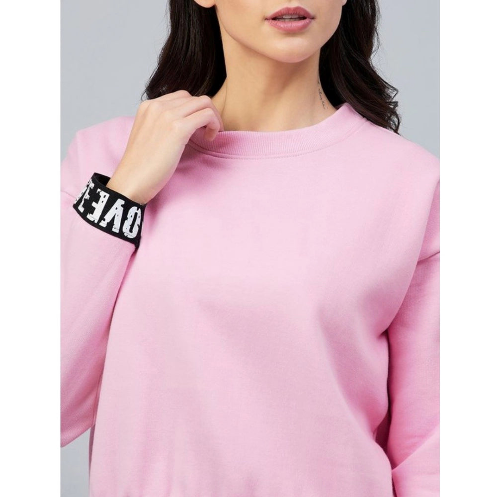 Pink fleece women's long-sleeve solid sweatshirt on model, round neck style