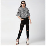 Black & White polyester animal print bell sleeve top for women, collar neckline, patterned fashion clothing on mannequin