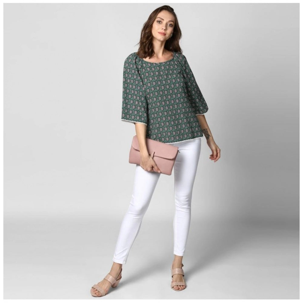 Green polyester printed 3/4 sleeves top for women, round neck style with printed pattern detail