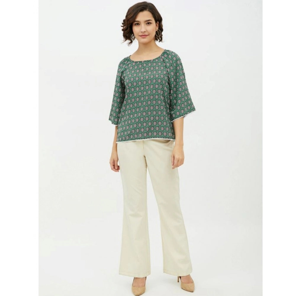 Green polyester printed 3/4th sleeves top for women, vibrant pattern design on round neck