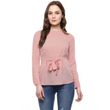 Pink polyester solid long-sleeve women's top on model, wearable for casual occasions