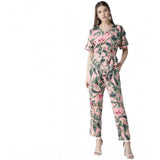 Pink polyester floral half-sleeve jumpsuit with V-neck, wearable floral fashion on model