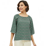 Green polyester printed 3/4th sleeves top with round neck, vibrant pattern detail