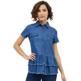 Blue denim peplum short sleeve top with collar, featuring a classic peplum design in medium blue denim fabric