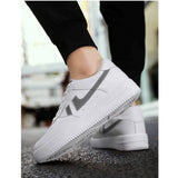 White synthetic casual lace-up sneakers for men, solid design on display stand