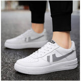 White synthetic casual lace-up sneakers for men, solid design on flat PVC sole
