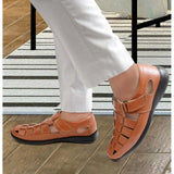 Tan faux leather men's casual sandal with solid design and Velcro closure on display