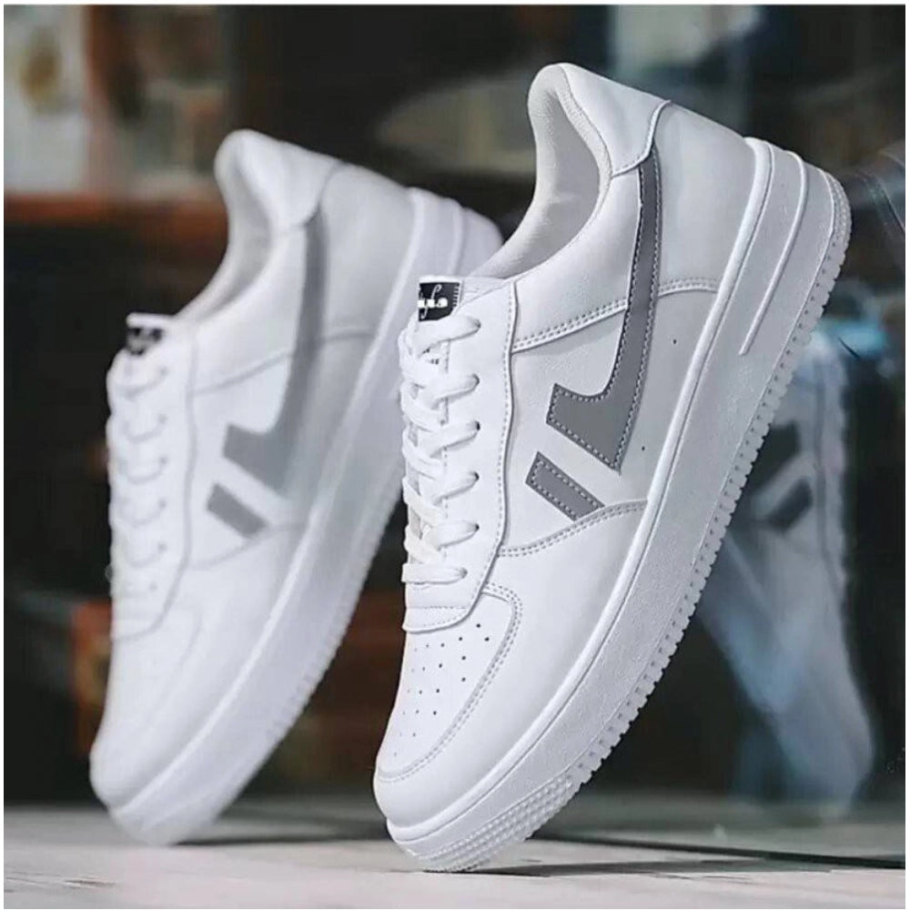 White synthetic lace-up sneakers for men, solid design on footwear rack