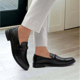 Black faux leather casual slip-ons for men, solid design with TPR sole