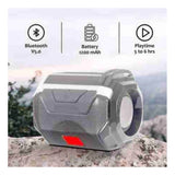 Grey plastic rubber wireless A005 Bluetooth speaker, USB chargeable on tabletop