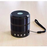 Black plastic rubber wireless Bluetooth speaker (WS887), USB chargeable, portable audio device on table
