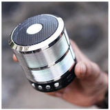 Silver plastic rubber wireless Bluetooth speaker (WS887), portable audio device on table for music streaming, USB chargeable