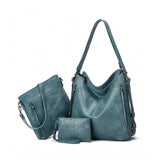 Blue PU leather medium shoulder zipper handbag with adjustable sling strap and two handle straps