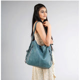 Blue PU leather medium shoulder zipper handbag with adjustable sling strap and two handle straps