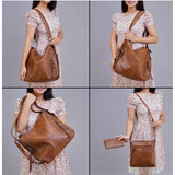 Brown PU leather medium shoulder zipper handbag with adjustable sling strap and two handle straps