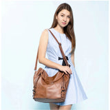 Brown PU leather large shoulder zipper handbag with round twin handles and adjustable sling strap